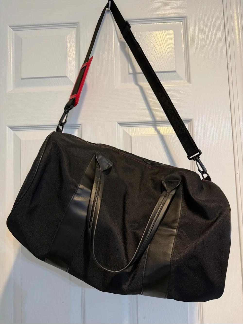 Givenchy Parfums Black Duffel Bag with Red Shoulder Pad